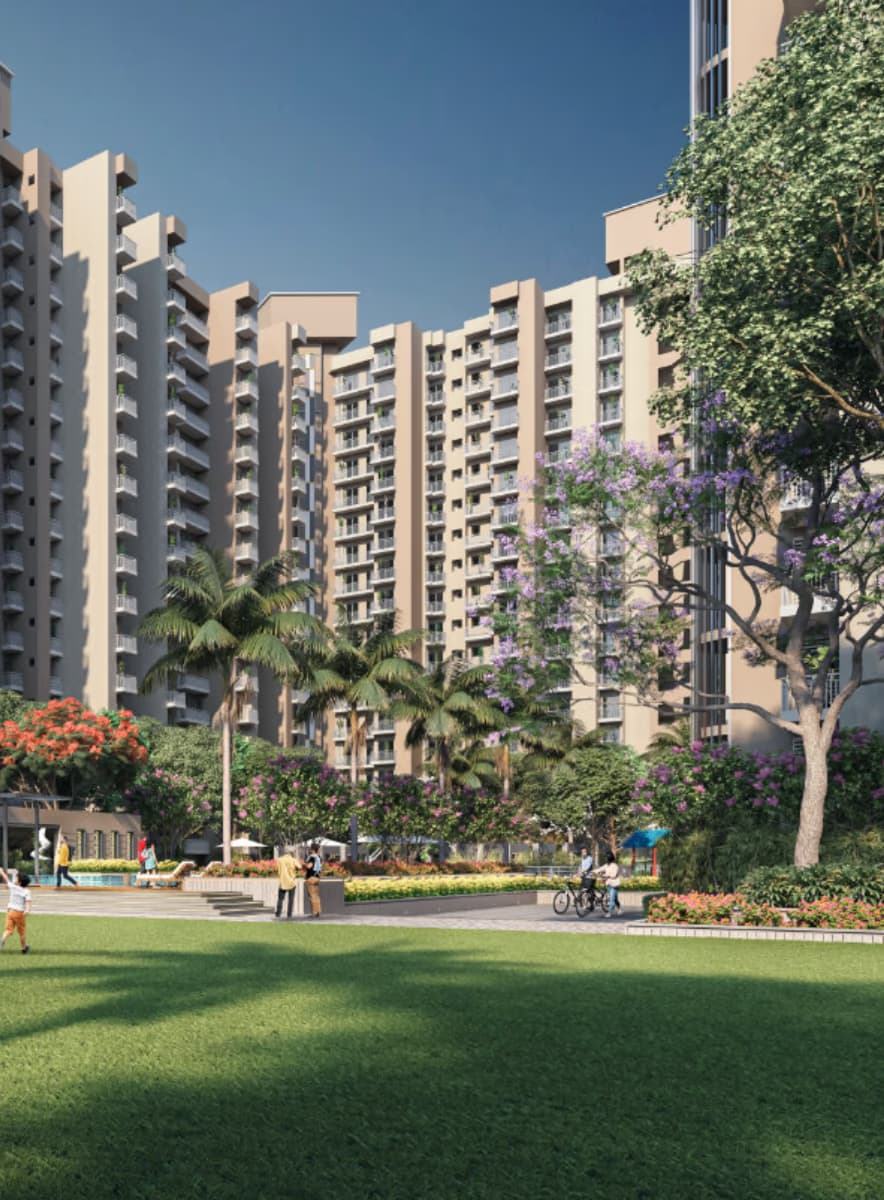 The illuminated arrival gateway and entrance plaza at Mayfair Residency
